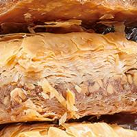 Baklava · Traditional Greek Pastry layered with flaky Filo dough, walnuts and honey