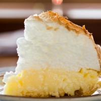 Coconut Meringue · Toasted coconut flakes are sprinkled over the meringue top which covers our creamy coconut f...