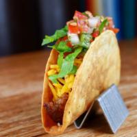 Impossible Taco · Classic crispy taco made with Impossible meat, El Camino sauce, plant based cheddar, lettuce...