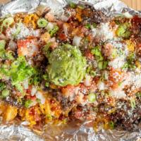 Carne Asada Fries · Waffle fries, cheddar-jack and cotija cheese, chopped steak, camino sauce, guacamole and pico.