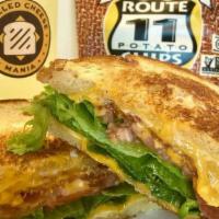 Chorizo Grilled Cheese · Chorizo, mozzarella, pepper jack cheese, sautéed jalapeños, red and green bell peppers on ch...