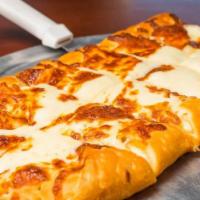 Cheese Bread · Our fresh homemade pizza dough, stuffed and topped with mozzarella cheese and baked to perfe...