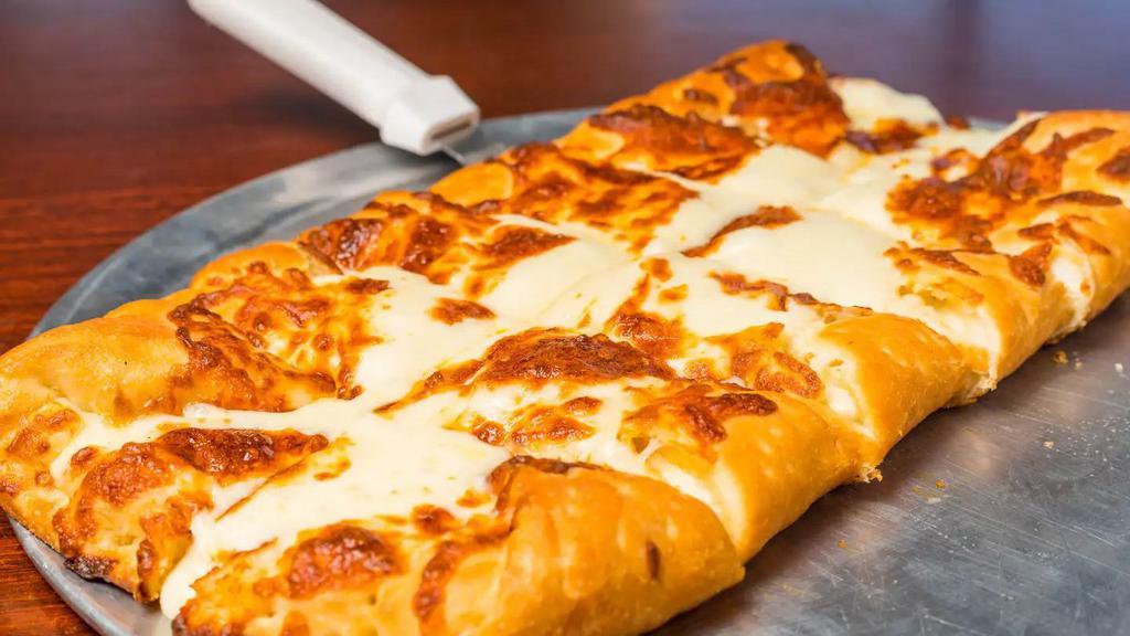 Cheese Bread · Our fresh homemade pizza dough, stuffed and topped with mozzarella cheese and baked to perfection! Served with a side of marinara for dipping!