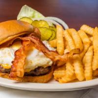 Bacon, Egg And Cheese Burger · A ½ pound handcrafted Angus beef burger, flame-broiled to perfection, topped with American c...