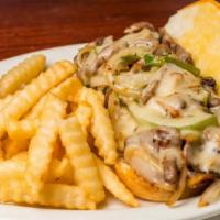 Philly Cheese Steak · Seasoned steak or chicken slices mixed with sauteed onions, peppers and mushrooms, topped wi...