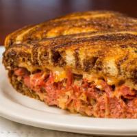 Reuben · A classic with corned beef, Thousand Island dressing, sauerkraut, and Swiss cheese on grille...