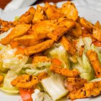 Buffalo Chicken Salad · A bed of fresh lettuce topped with your choice of grilled or breaded chicken strips tossed i...