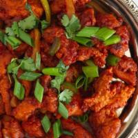 Chicken Chilli · Boneless chicken sautéed with hot chilies and onions.