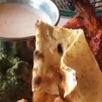 Chicken Tandoori · Juicy spring chicken with bone marinated in flavorful ground spices and roasted in the tando...