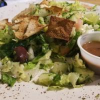Fattoush Salad · Romaine lettuce, tomatoes, cucumber. Feta Cheese, Pita chips Dressed with balsamic vinaigret...