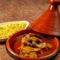 Classic Chicken Tagine · Boneless Skinless Chicken Thighs  with potatoes, olive, preserved lemon slow cooked in saffr...