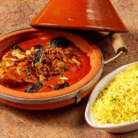 Golden Raisins Chicken Tagine · Boneless Skinless Chicken Thighs with raisins cooked in saffron sauce topped with roasted al...