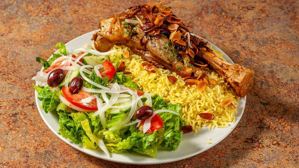 Lamb Kabsa Rice Platter · Popular. Slow cooked lamb shank with our house spices, Served  over Basmati Rice With Side Green Salad.topped with parsley, grilled onion, and roasted almonds.