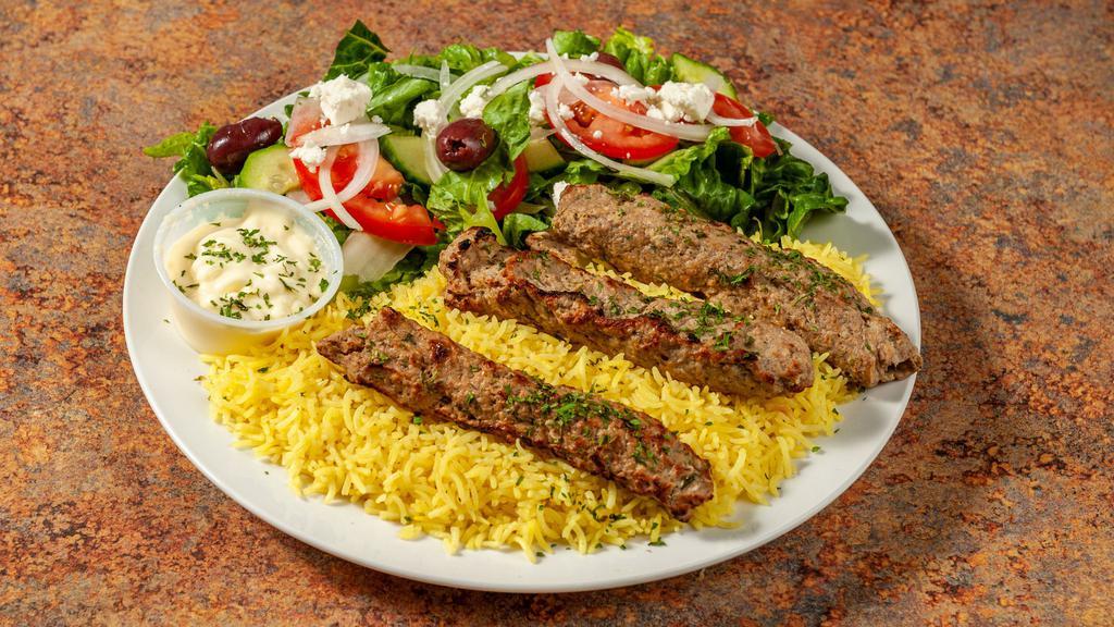 Chicken Kabob (2 Skewers) · New. Marinated Ground chicken breast  mixed with our house spices, Served  over Basmati Rice With Side Green Salad.