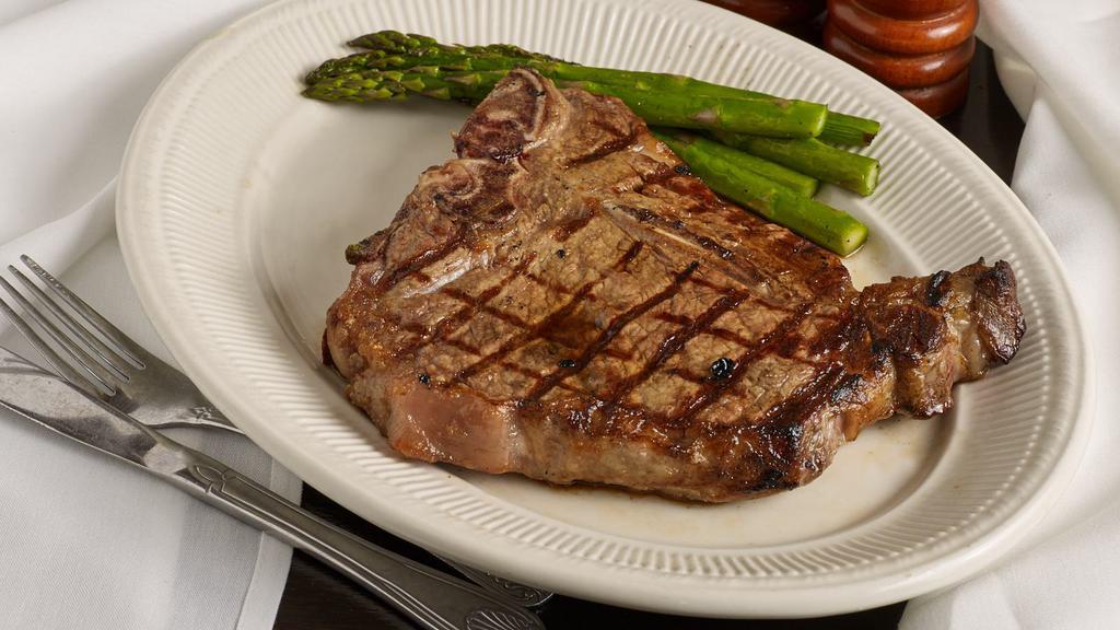 Black Angus Porterhouse Steak (24 Oz.) · Combines the tender filet mignon with the meaty-flavored new york strip. served with starch and fresh vegetables.