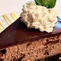 Chocolate Mousse Pie  · Rich bittersweet chocolate mousse on a oreo cookie crust encased in chocolate ganache with c...