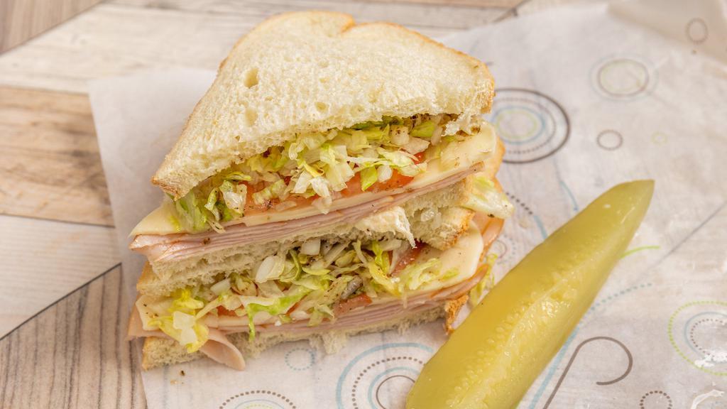 Deli Sandwiches · Your choice of ham or turkey, cheese, mayo, onion, tomato, and lettuce.