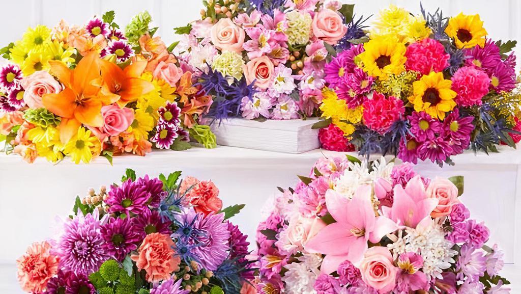 Designer'S Choice Hand-Wrapped Bouquet - Mixed Flowers  · Our fresh market bouquets of showy, colorful blooms are created with a selection of splendid varieties that are simply beautiful and perfect for any occasion! Vase not included.