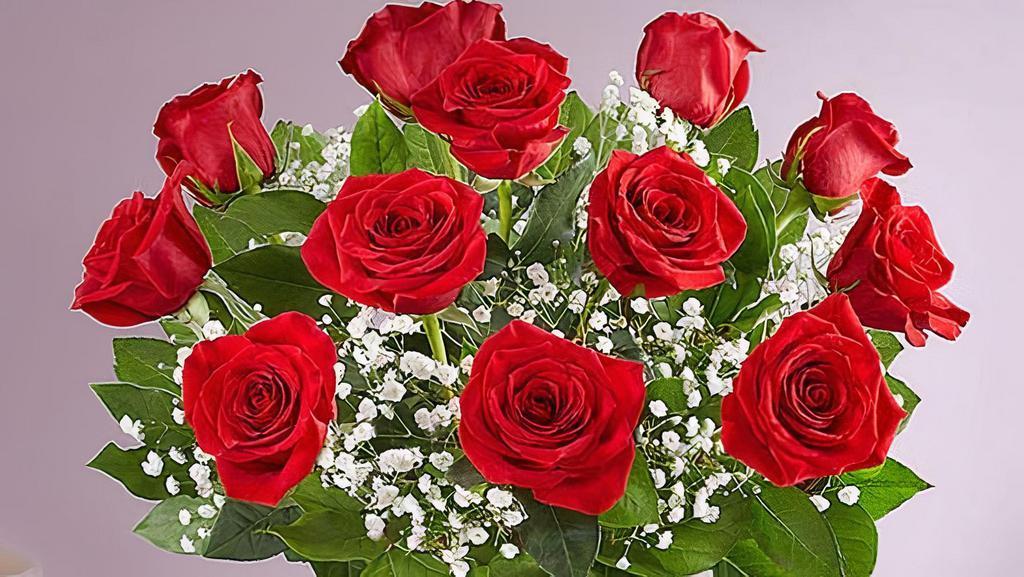 Rose Elegance Premium Long Stem Roses · Our premium long stem roses are an elegant surprise for the one you love with all your heart. Beautifully arranged by our expert florists with lush greenery inside a classic glass vase.