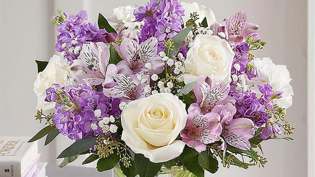 Lovely Lavender Medley - Medium · Lovely memories are made with thoughtful gifts for the ones we care about. Our charming bouquet is loosely gathered with a medley of lavender & white blooms. 

Medium arrangement measures approximately 13