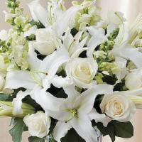 Classic All White Arrangement · Pristine white roses, lilies and snapdragons are hand-gathered by our florists with touches ...