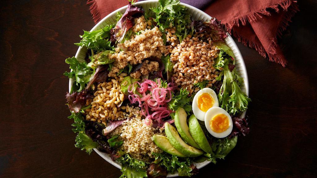Heritage Grains Bowl · Heritage grain blend of quinoa, faro, manoomin wild rice, amaranth, and kamut topped with sliced avocado, soft egg, and pickled red onion.  Bright and flavorful fresh herb vinaigrette.