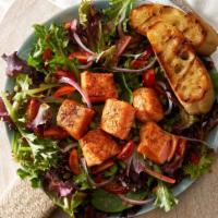 Seared Salmon Salad · Pan seared salmon, mixed greens, red onions, grape tomatoes and capers with grilled baguette...