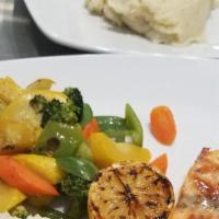 Grilled Salmon · SERVED WITH MASHED POTATOESSAUTEED VEGETABLES AND LEMON BUTTER SAUCE..