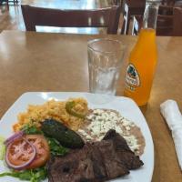 Carne Azada Dinner · GRILL SKIRT STEAK SERVED WITH RICE, BEANS, SALAD AND CORN TORTILLAS.