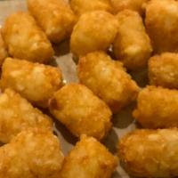 Tater Tots · Heaping pile of tater tots fried to a golden brown
