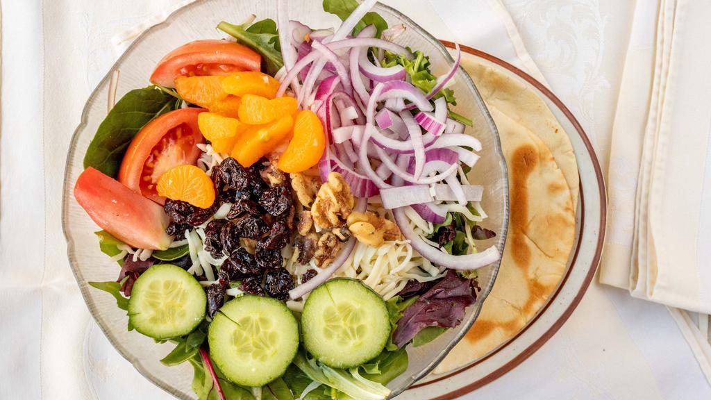 Michigan Salad (Medium) · Spring mix, dry cherries, mandarin oranges, walnuts, tomato, cucumber slices, onions, mozzarella cheese and raspberry vinaigrette dressing