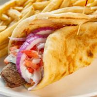 Gyro Dinner · Seasoned lamb blend served with lettuce, onions, tomatoes and gyro sauce (Tzatziki) on a pita.
