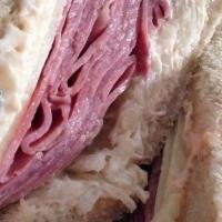 The Reuben · Corned beef, Swiss cheese, Russian dressing and sauerkraut on roasted rye bread.