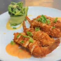 Coconut Shrimp · Five battered and quick fried with sriracha aioli and mixed greens.