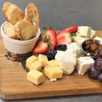 Cheese Board · Gluten free preparation. Artisan cheeses, golden raisin mostarda, figs, grapes, crostini.