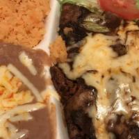 Enchiladas · Three hand-rolled tortillas stuffed with your choice of filling, covered in your choice of s...