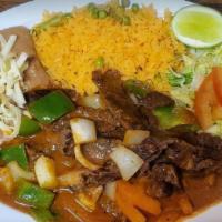 Bistec A La Mexicana · Spicy. Juicy steak seasoned and stuffed with a bell or jalapeño pepper, onion, and tomato. S...
