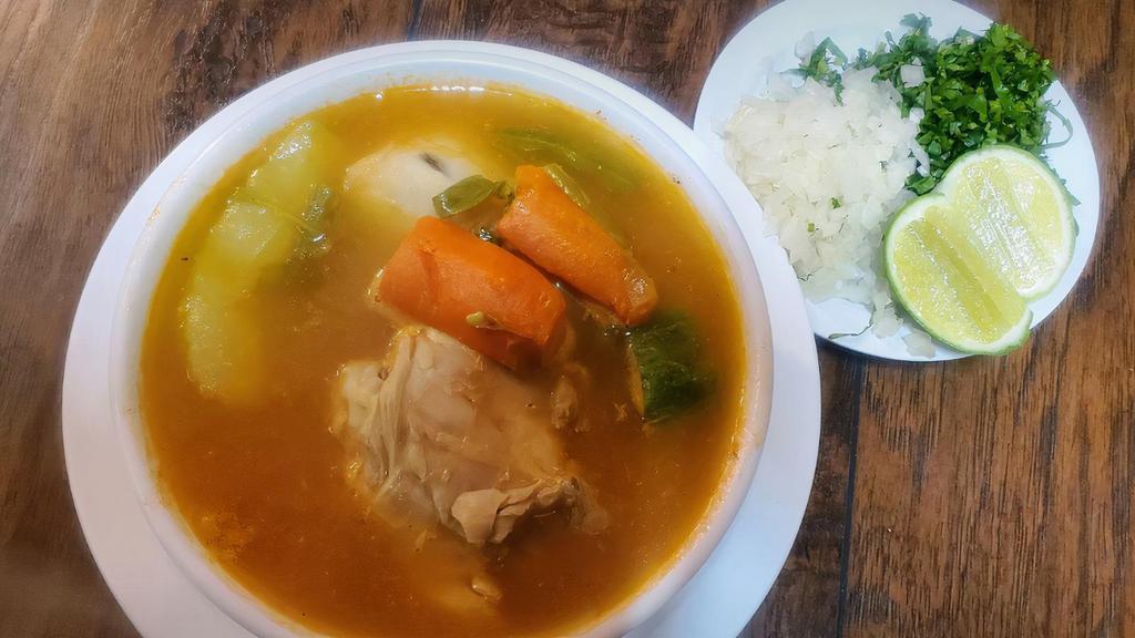 Caldo De Pollo · Chicken soup with vegetables.