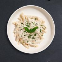 Alfredo Pasta (Penne) · Penne pasta cooked in creamy white sauce topped with parmesan.