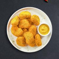 Nuggets · Bite sized nuggets of chicken breaded and fried until golden brown. Served with your choice ...