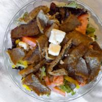 Greek Salad · Lettuce, tomatoes, 4 small feta, 3 olives, onions, 5 banana peppers and side of Vinaigrette....