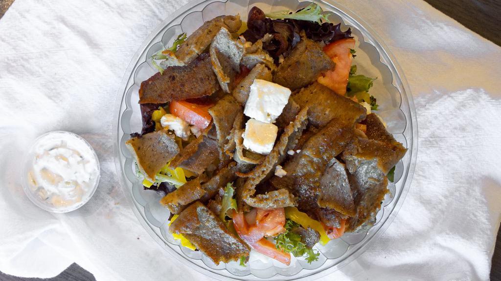 Greek Salad · Lettuce, tomatoes, 4 small feta, 3 olives, onions, 5 banana peppers and side of Vinaigrette.  (Add chicken or gyro meat for and additional cost).