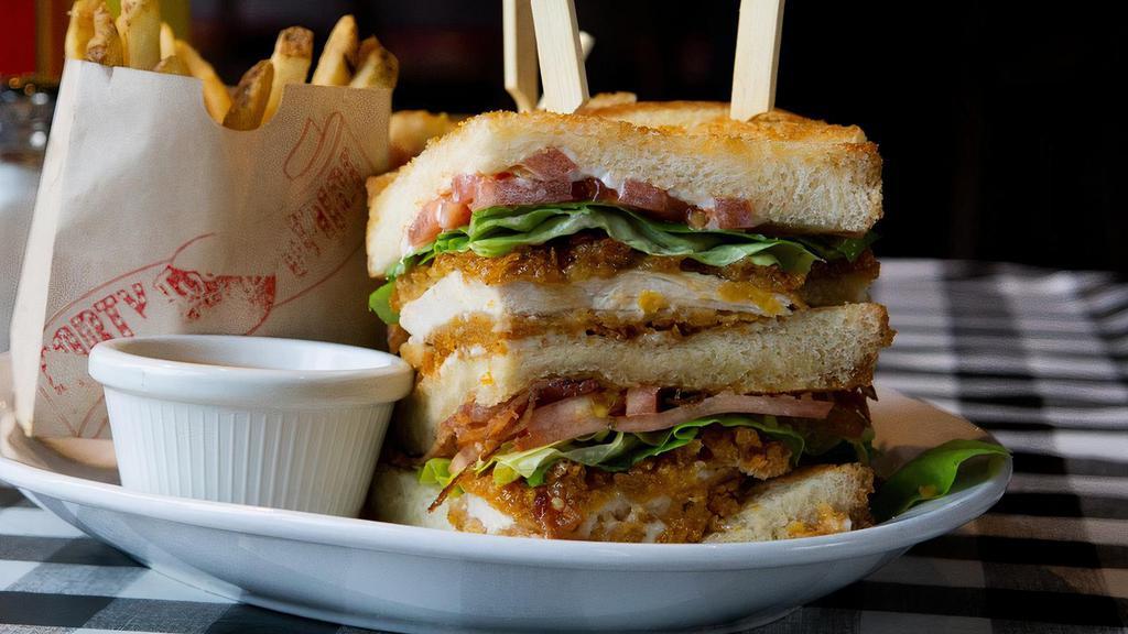 The Cbgb · Fried Chicken Club-cornflake crusted fried chicken glazed with honey butter sauce, bib lettuce, tomato, smoked bacon, ranch aioli, texas toast  (served with fries or tots)