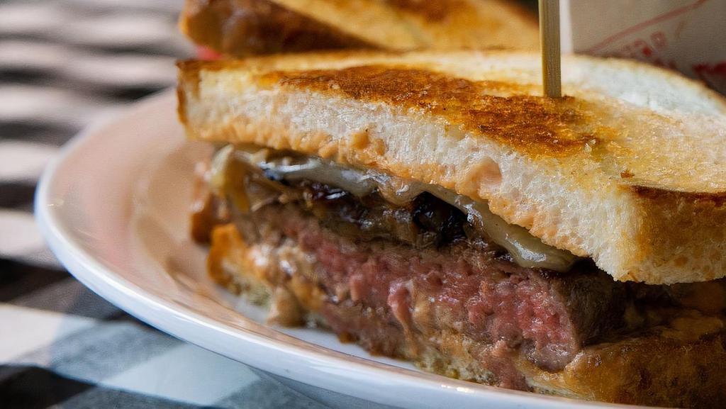 The Playbill · Patty Melt-beef patty, caramelized onions, baby swiss cheese, housemade thousand island, toasted sourdough  (served with fries or tots)
