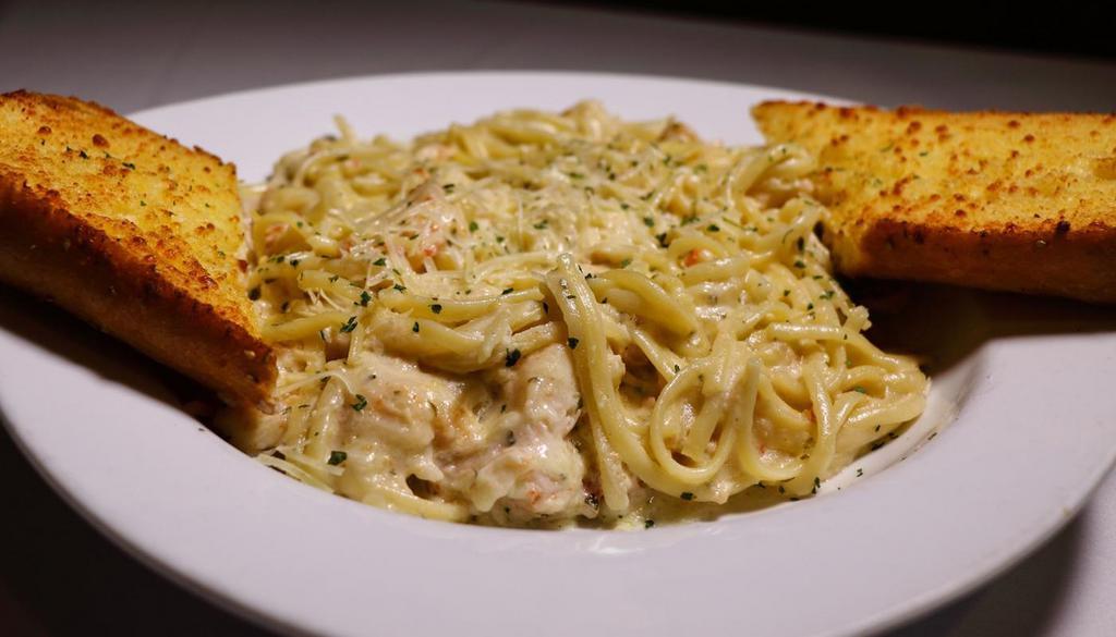 Crab Linguini · Over One-Half Pound of True Snow crab, Sautéed to Perfection in our Signature Alfredo Sauce, Served over a Bed of Linguini