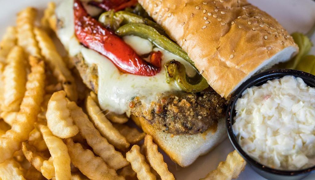 Sicilian Steak Sandwich · A generous portion of hand cut Beef Tenderloin, perfectly seasoned with Italian Spices, breaded and smothered with Red & Green Peppers, Onions and Mozzarella Cheese