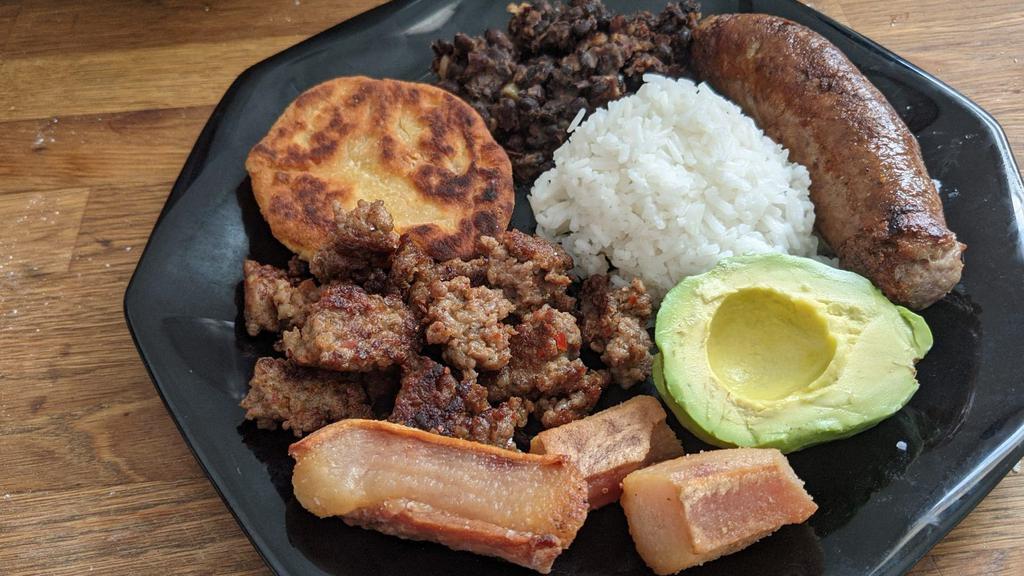 Bandeja Paisa · Served with white rice, beans, eggs, fried plantain, avocado, Colombian sausage, pork rind, and grilled steak or ground beef.