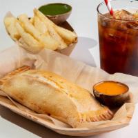 Empanada · Our baked empanadas have five ounces of delicious stuffing. Pick your favorite.