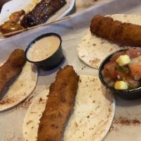 Fish Tacos · Three fried cod. Lime chipotle ranch, mango pico, arugula.