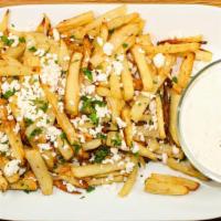 Greek Fries · French fries topped with crumbled Greek feta cheese, oregano and olive oil.